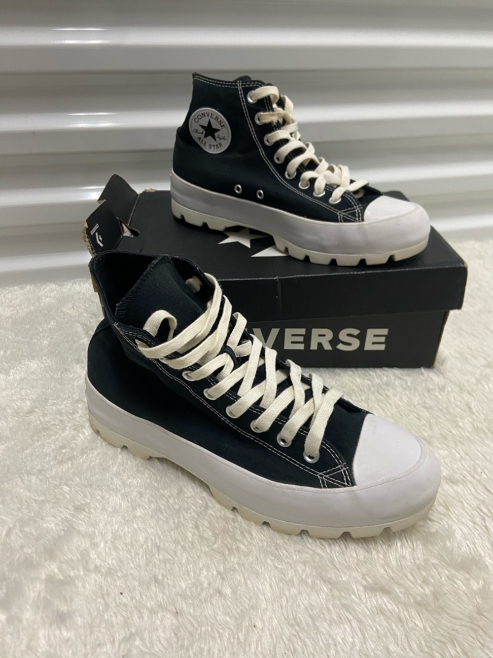 Converse High Top Lugged Sneakers in Black and Cream